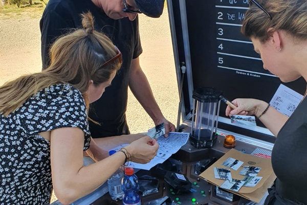 People try to solve the puzzle opened in the Escaperoom on a bicycle