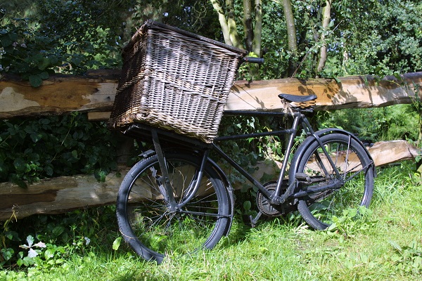 Bicycle against a fence at Limburgs Open-Air Museum Eynderhoof